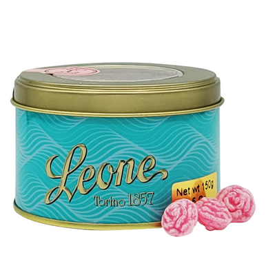 Leone brand candy tin with pink candies on a white background