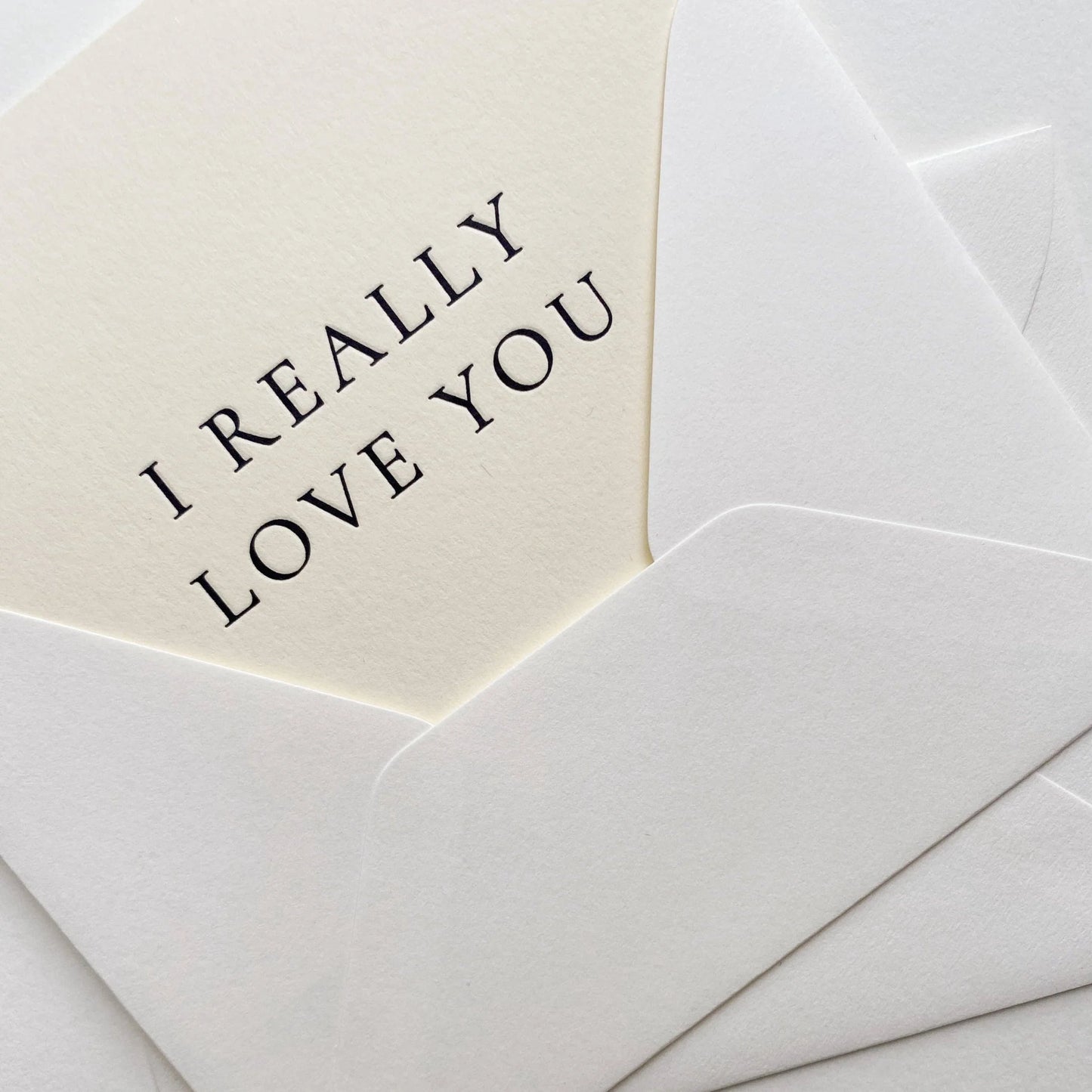 Envelope with 'I REALLY LOVE YOU' message on a white background