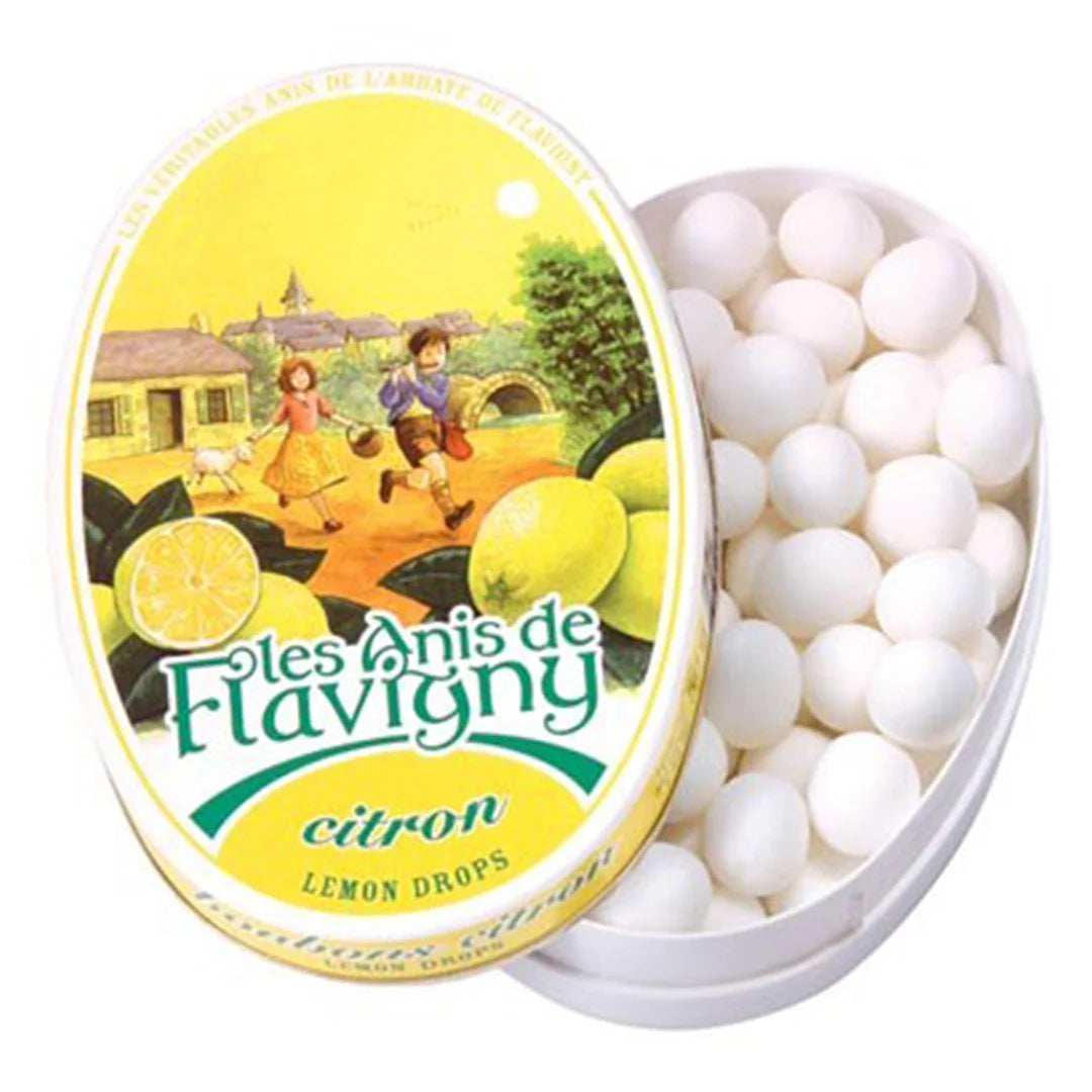 Tin of lemon drops with a colorful label featuring children and lemons.