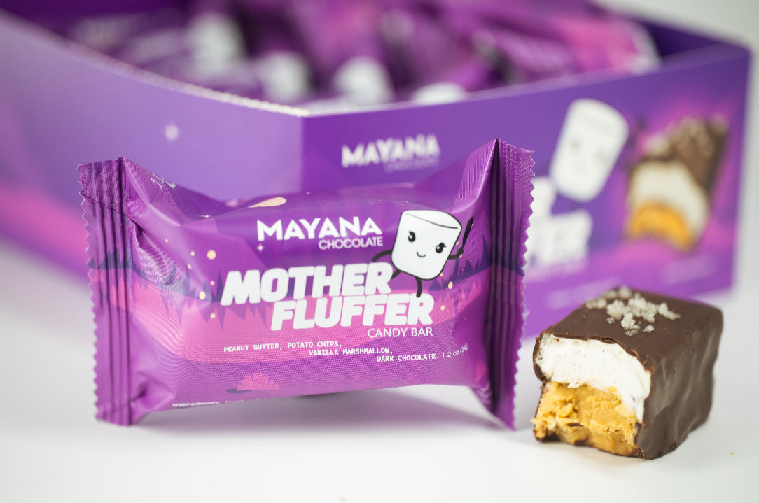 Mayana Mother Fluffer candy bar packaging with a piece of candy bar on a white background