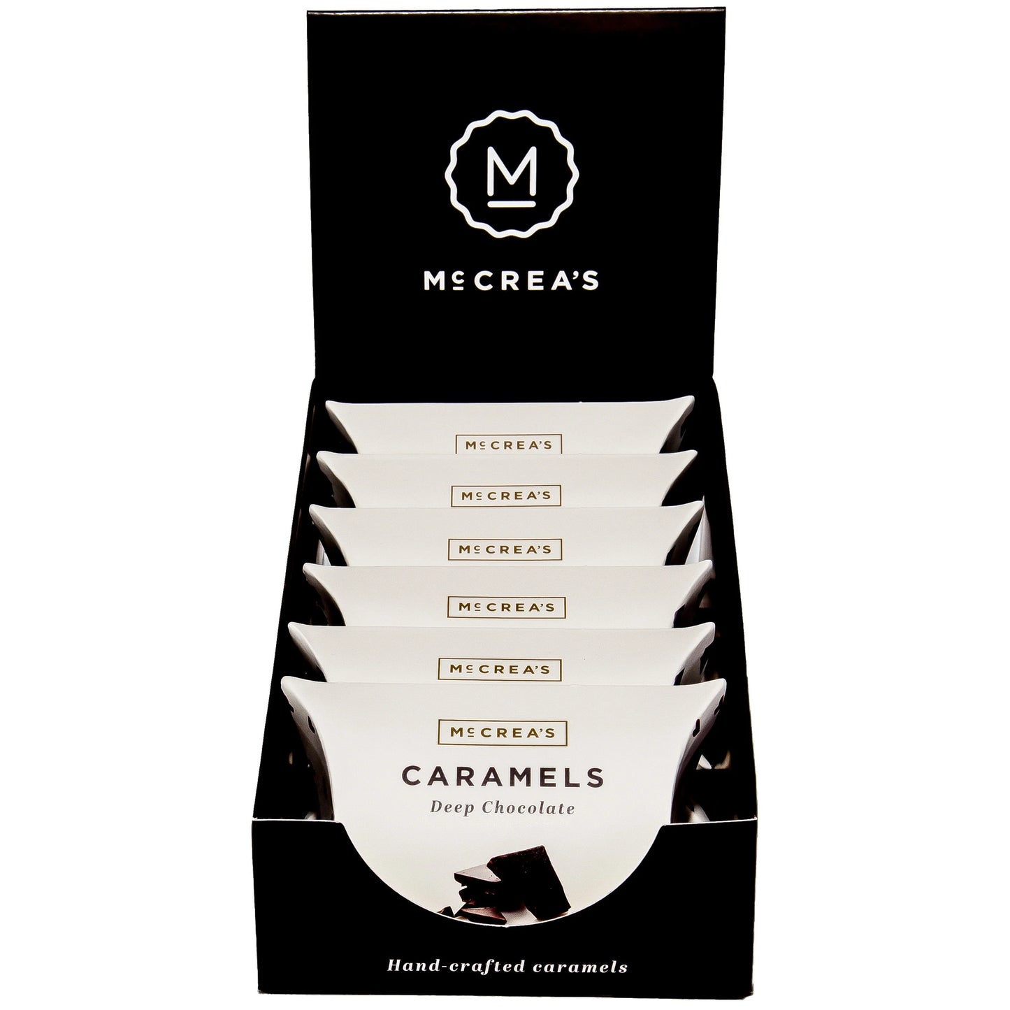 Display of Mécrea's Caramels packaging with brand logo on a white background
