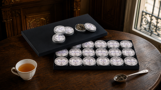 Open Mariage Frères Grand Coffret Henri displaying eighteen miniature tea tins