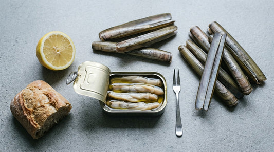 Galician razor clams with an open tin of preserved razor clams, bread and lemon
