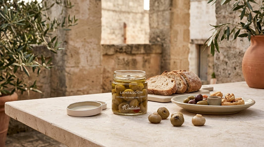 Lampascioni preserved in oil with an I Contadini jar and a Puglian antipasto plate