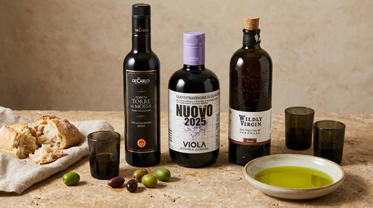 Selection of extra virgin olive oils with green olives, bread and tasting glasses