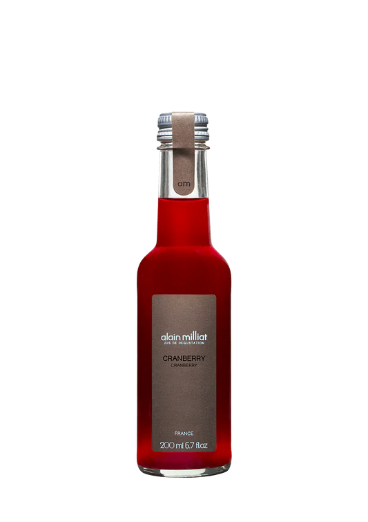 Red bottle with silver cap on a white background