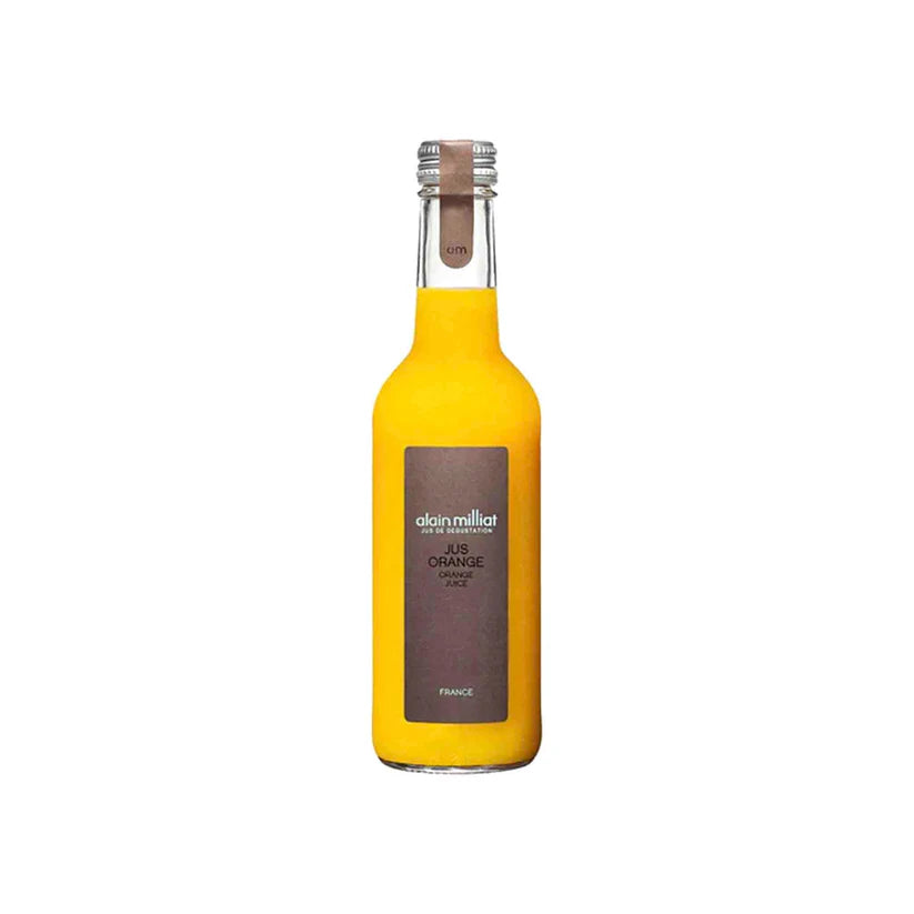 Yellow bottle of Alain Milliat orange juice on a white background