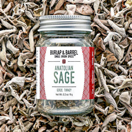Jar of Anatolian Sage from Burlap & Barrel on a bed of dried sage leaves.