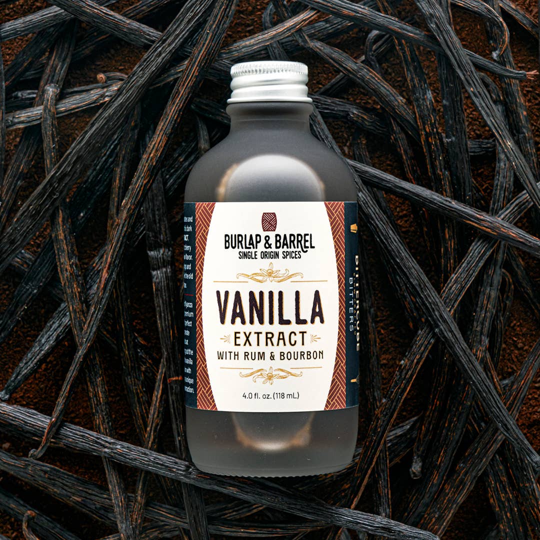 Bottle of Burlap & Barrel Vanilla Extract with Rum & Bourbon on a dark background