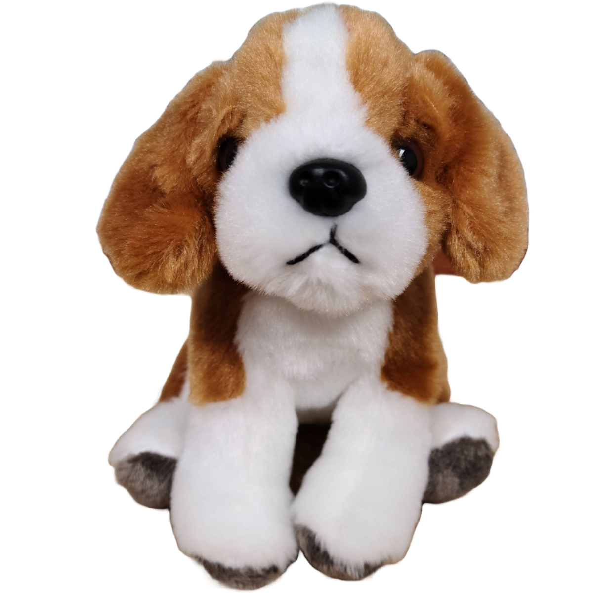 Plush toy dog with brown, white, and black fur on a white background