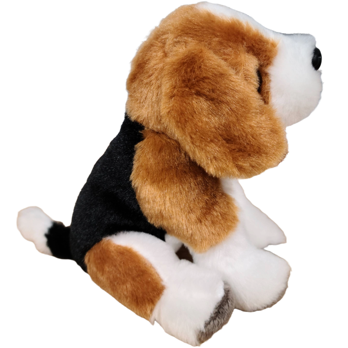 Plush toy dog with brown, black, and white fur on a white background