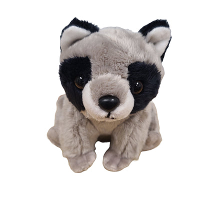 Plush toy raccoon on a white background