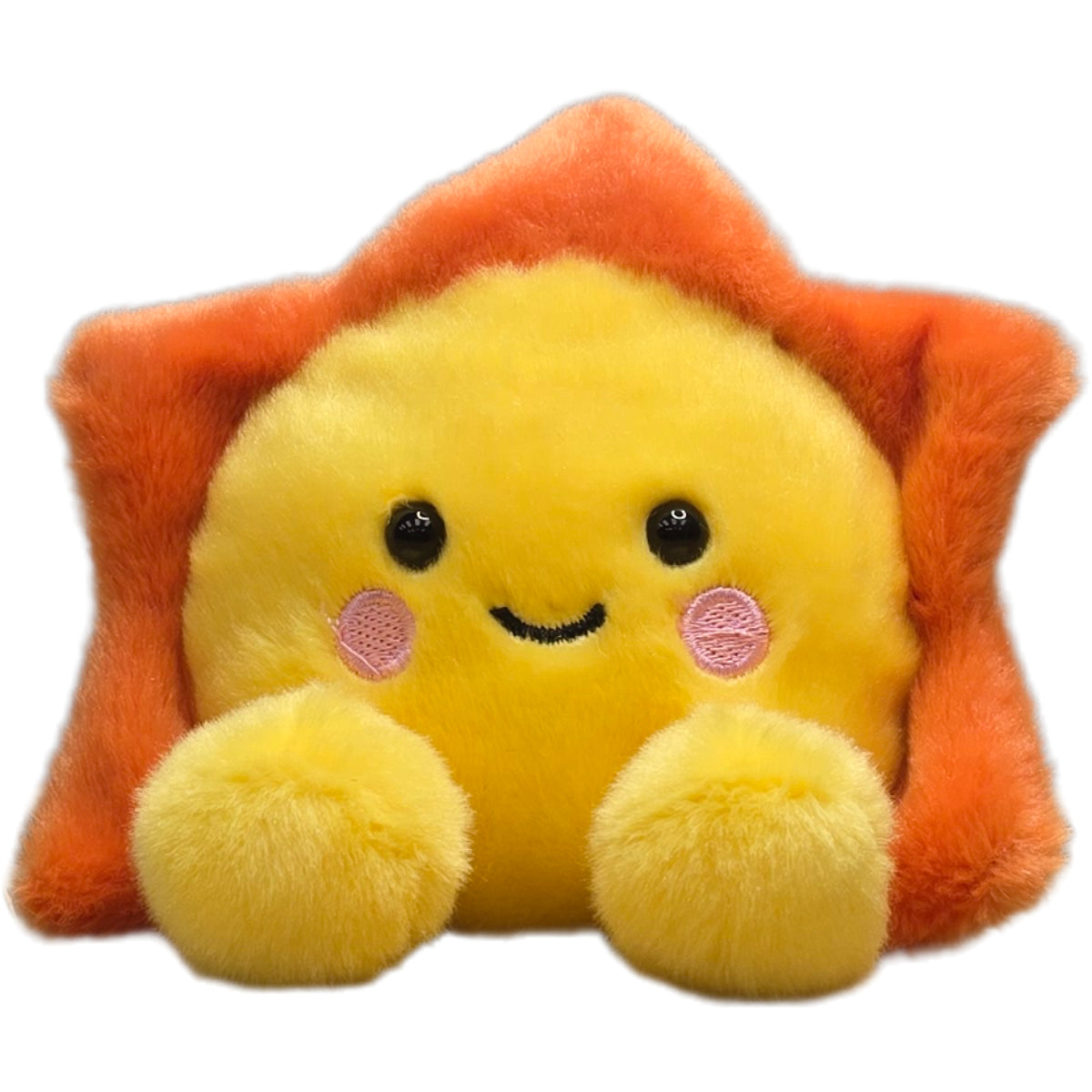 Plush toy shaped like a sun with a smiling face on an orange background