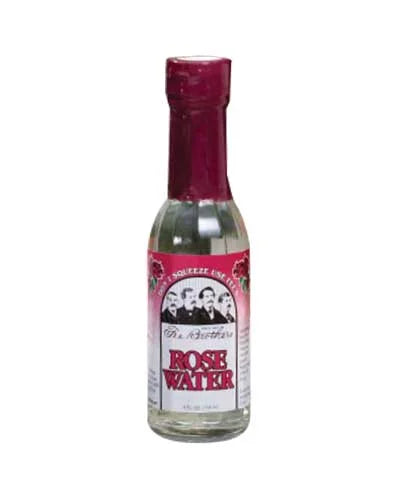 Bottle of rose water with a pink label on a white background