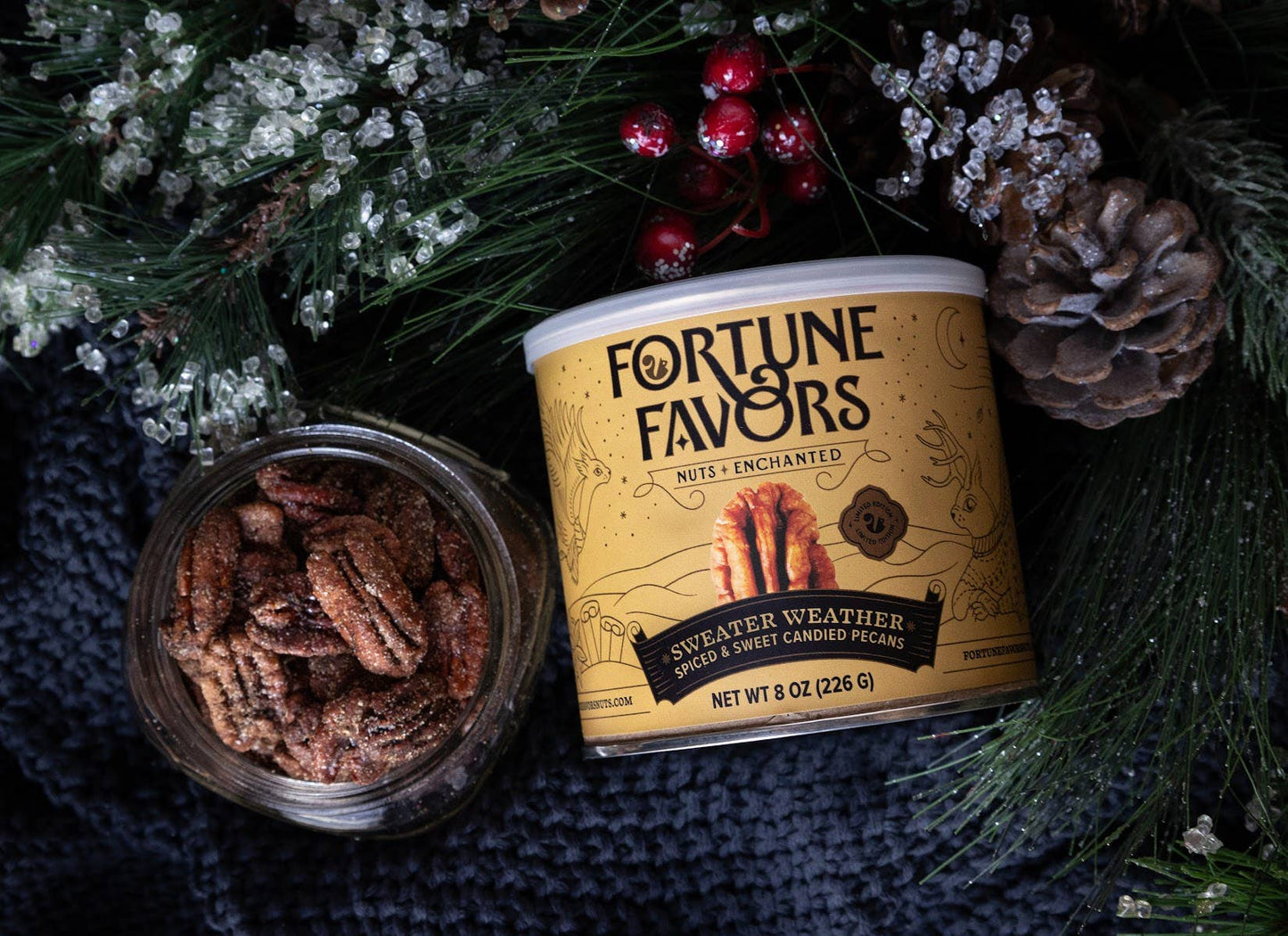 Fortune Favors nut packaging with a jar of nuts on a textured surface with decorative elements.