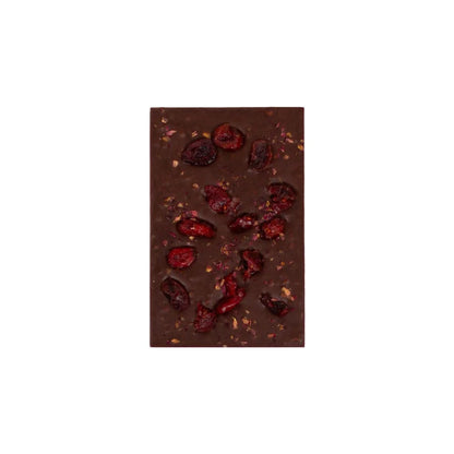 Dark chocolate bar with dried berries on a white background