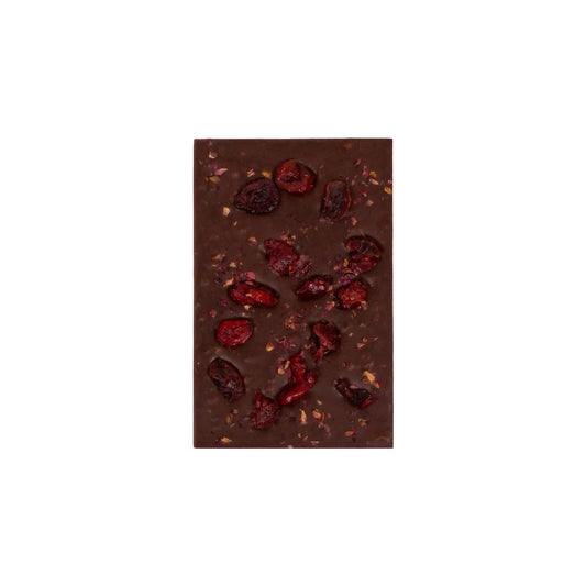 Dark chocolate bar with dried berries on a white background