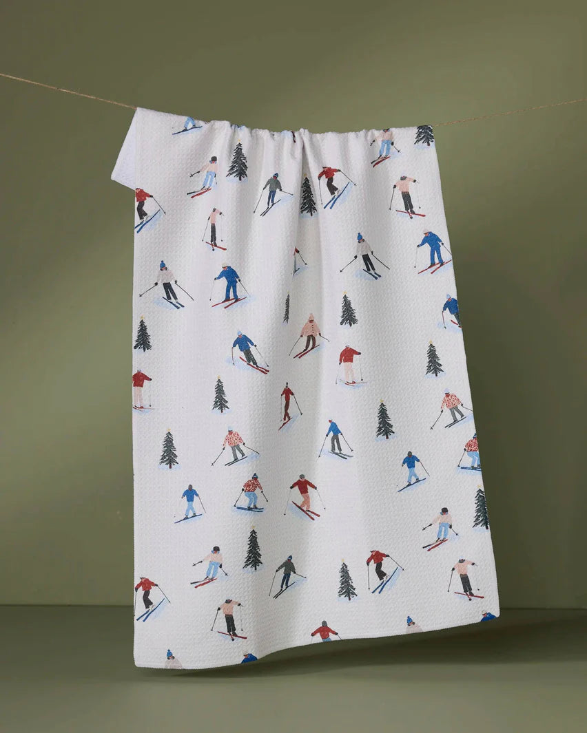 Fabric with skiing pattern on a green background