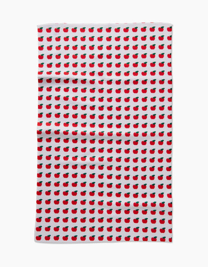 Tea towel with red apple pattern on a white background