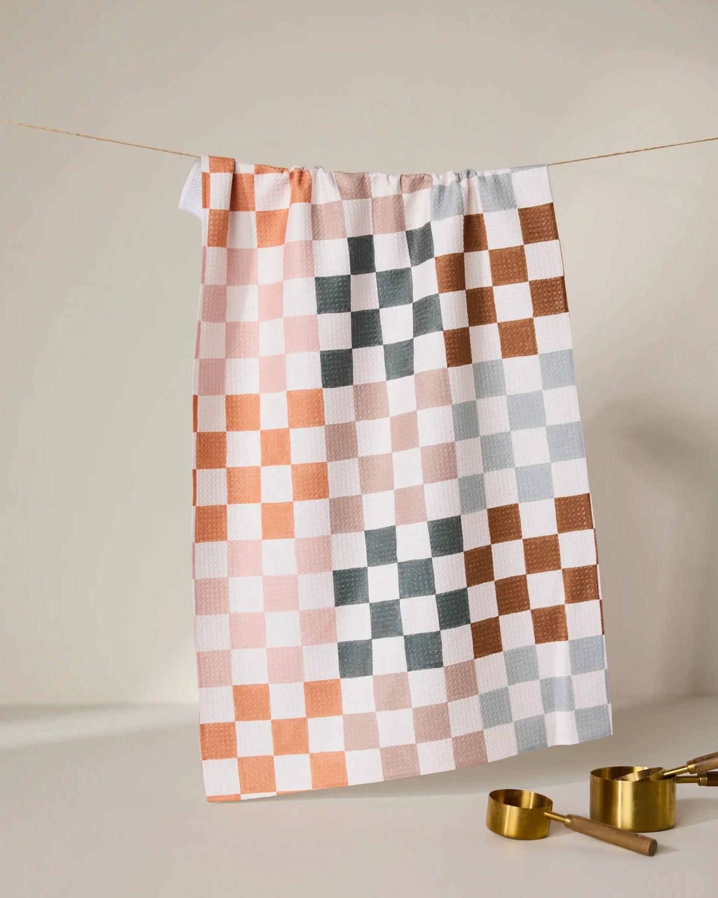 Checkered towel with geometric pattern on a neutral background