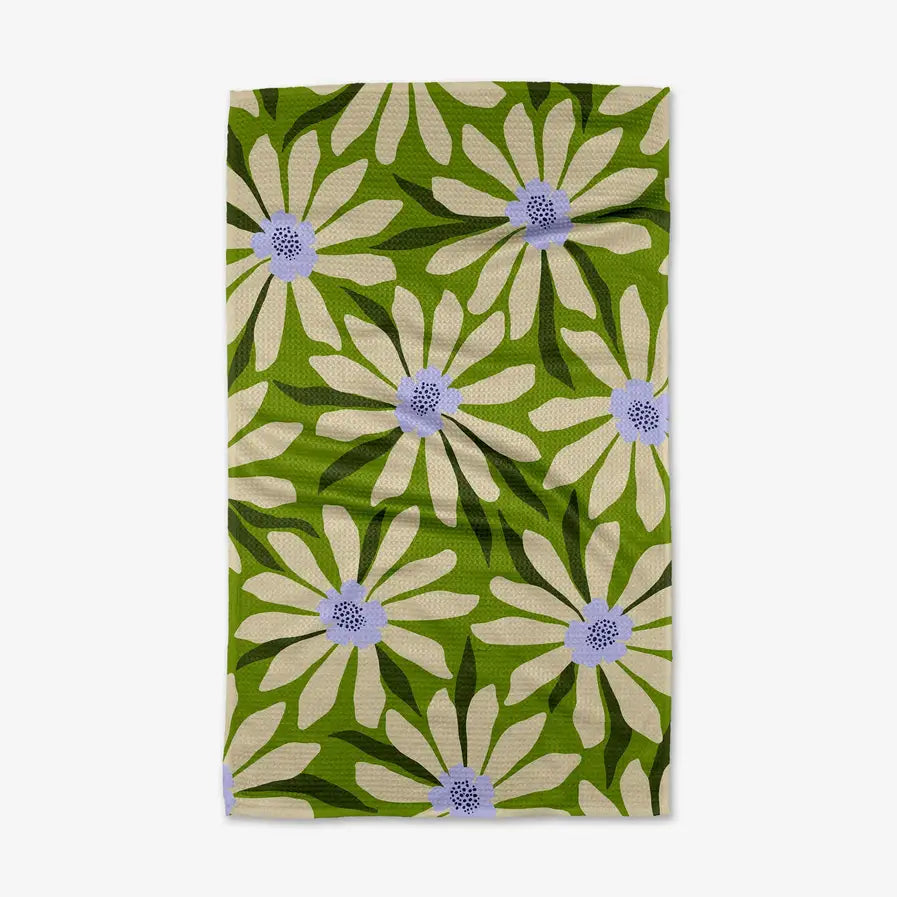 Floral patterned towel with white flowers on a green background