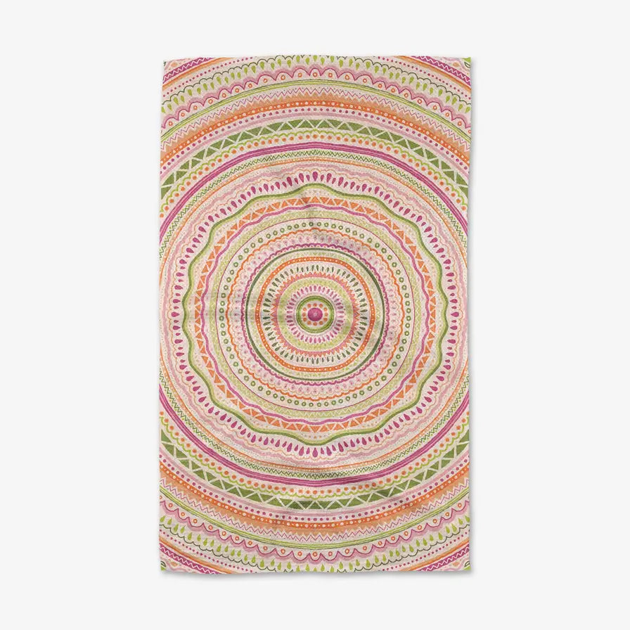 Colorful circular patterned towel on a white background