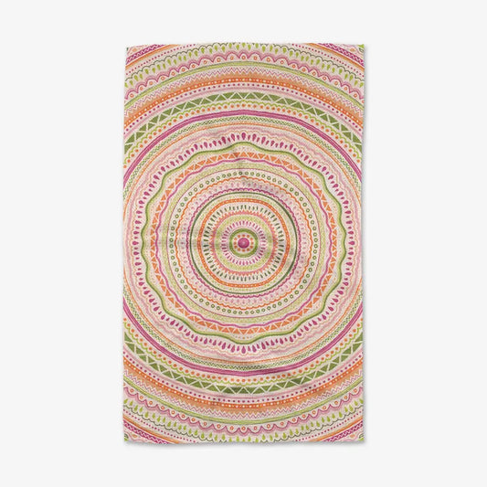 Colorful circular patterned towel on a white background
