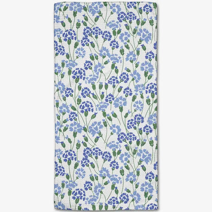 Floral patterned towel with blue flowers on a white background