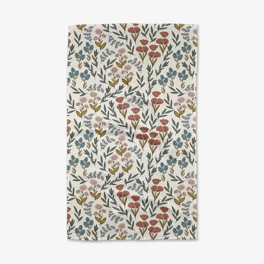 Floral patterned towel with small flowers on a white background
