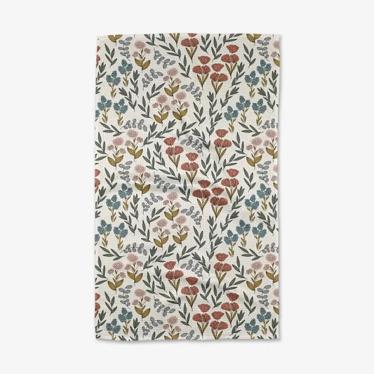 Floral patterned towel with small flowers on a white background