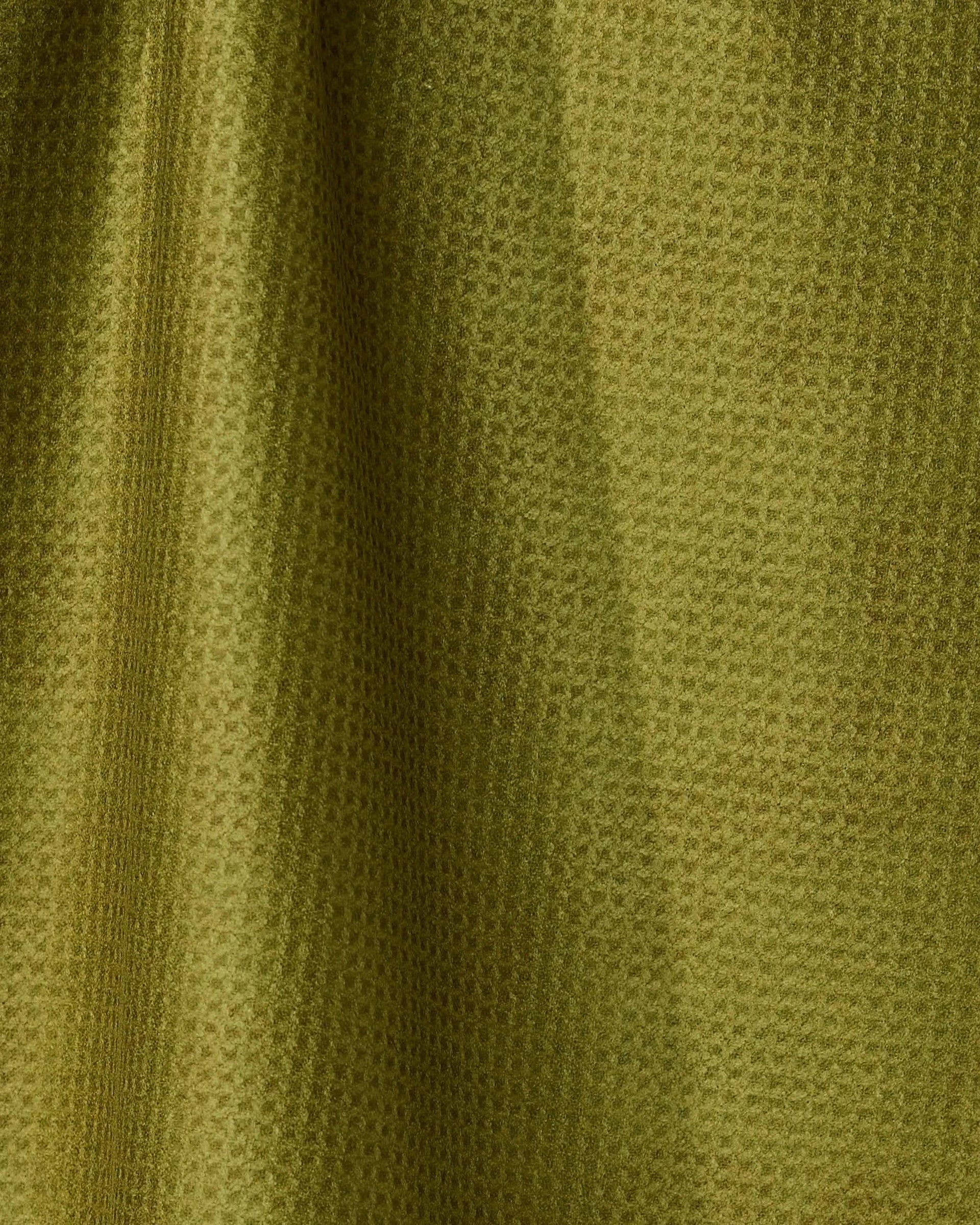 Close-up of green fabric with a subtle pattern