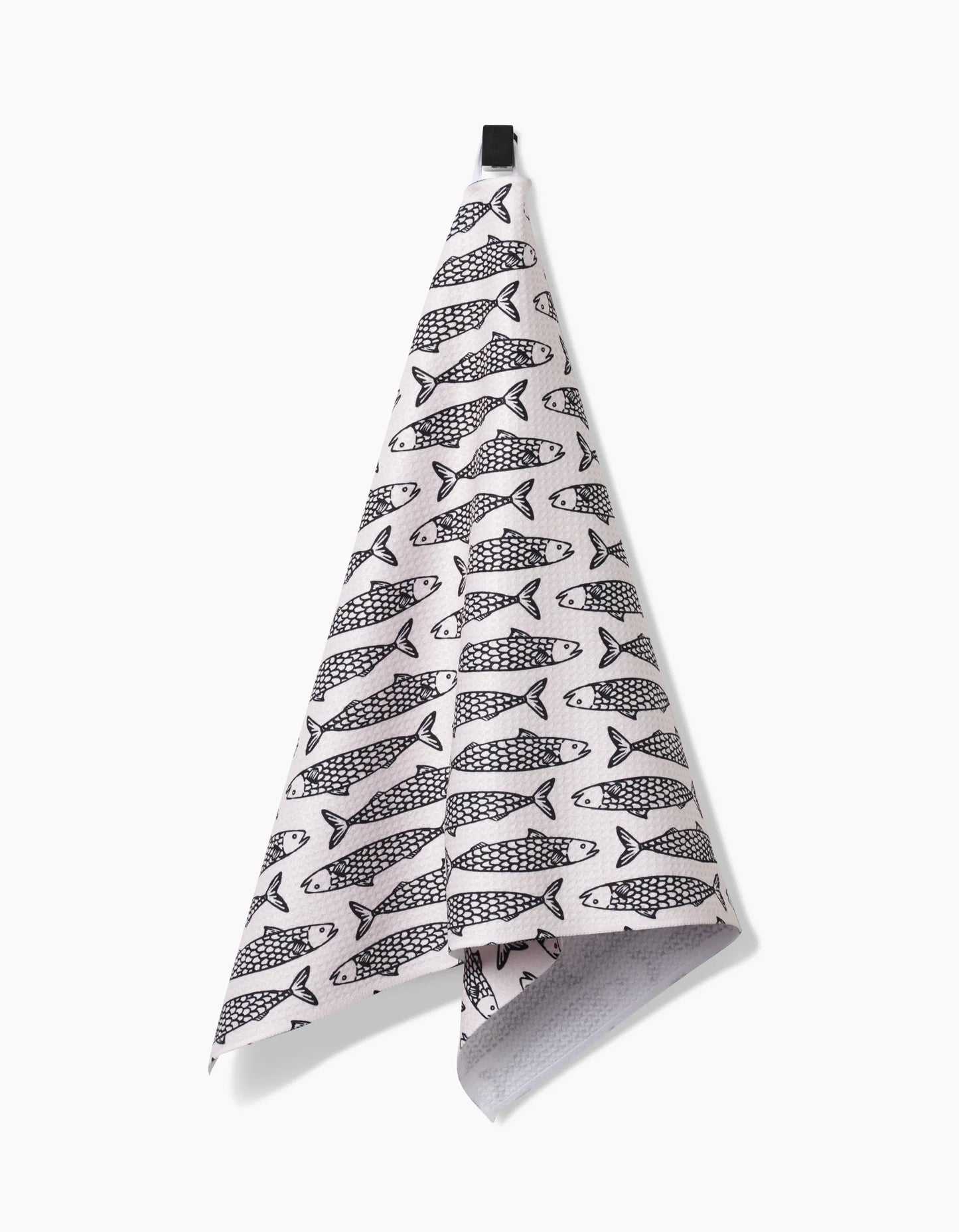 Folded towel with fish pattern on a white background