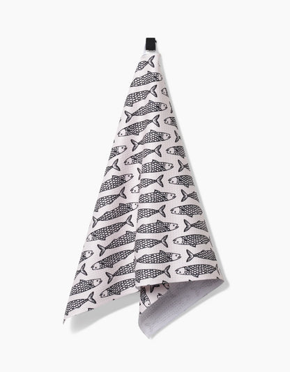 Folded towel with fish pattern on a white background