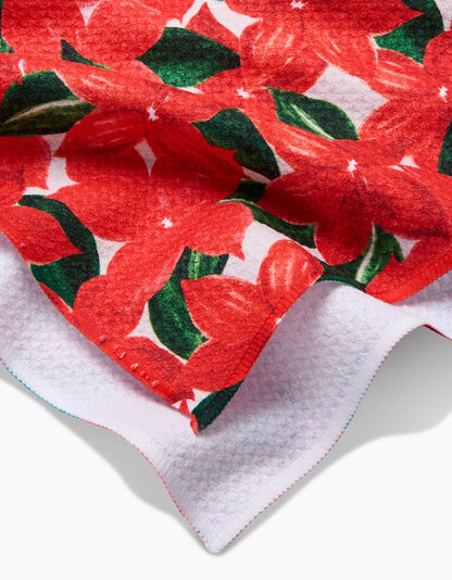 Red floral fabric with green leaves on a white background