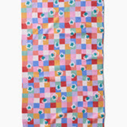 Colorful checkered fabric with floral patterns on a white background