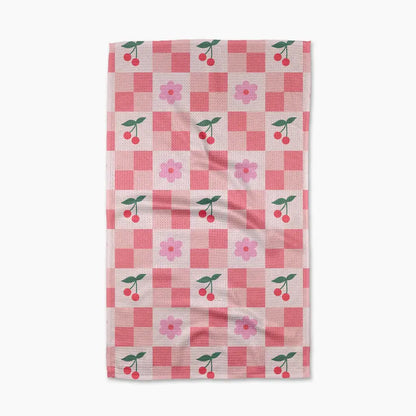Checkered towel with cherry and flower pattern on a white background