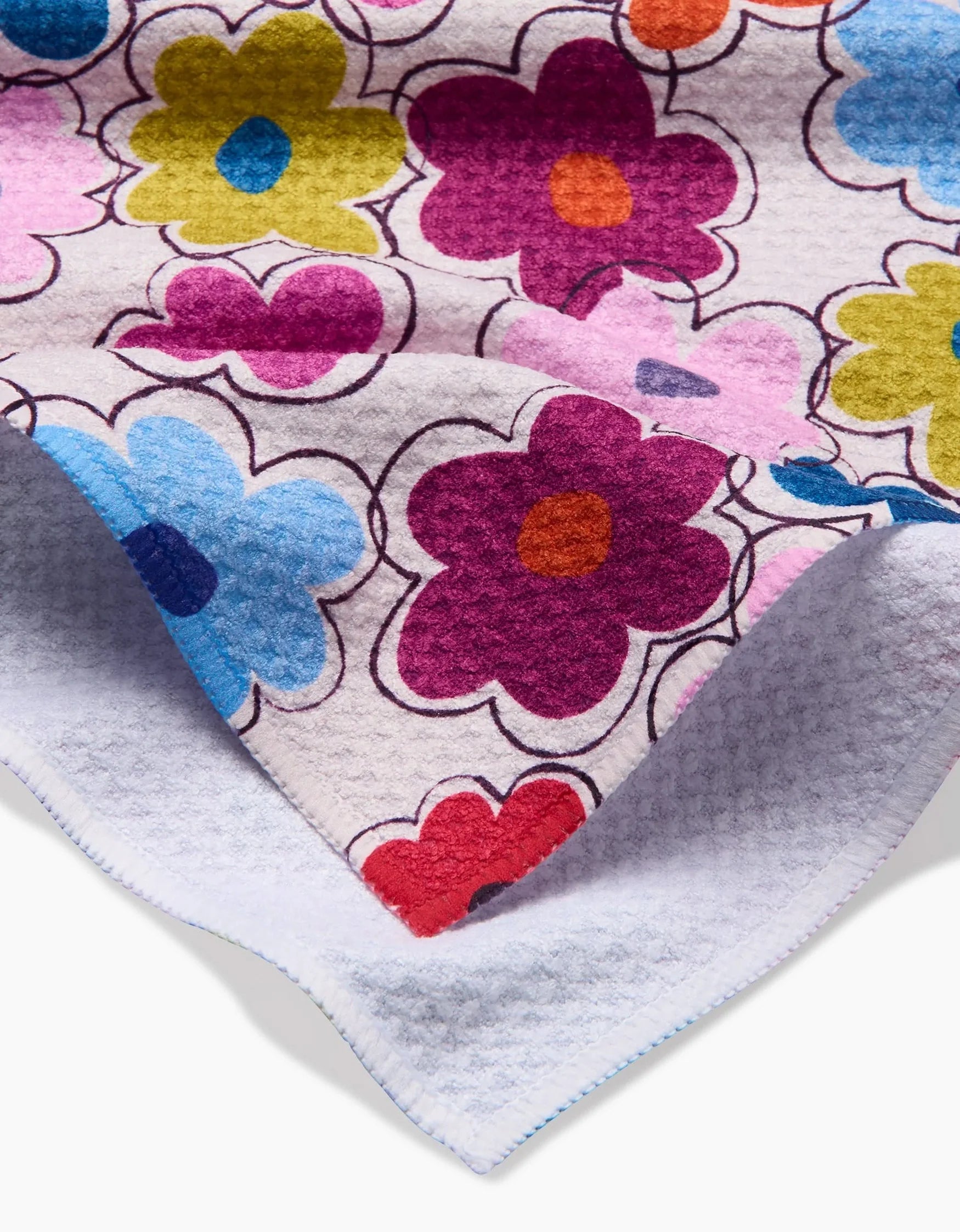 Floral-patterned fabric with colorful flowers on a white background