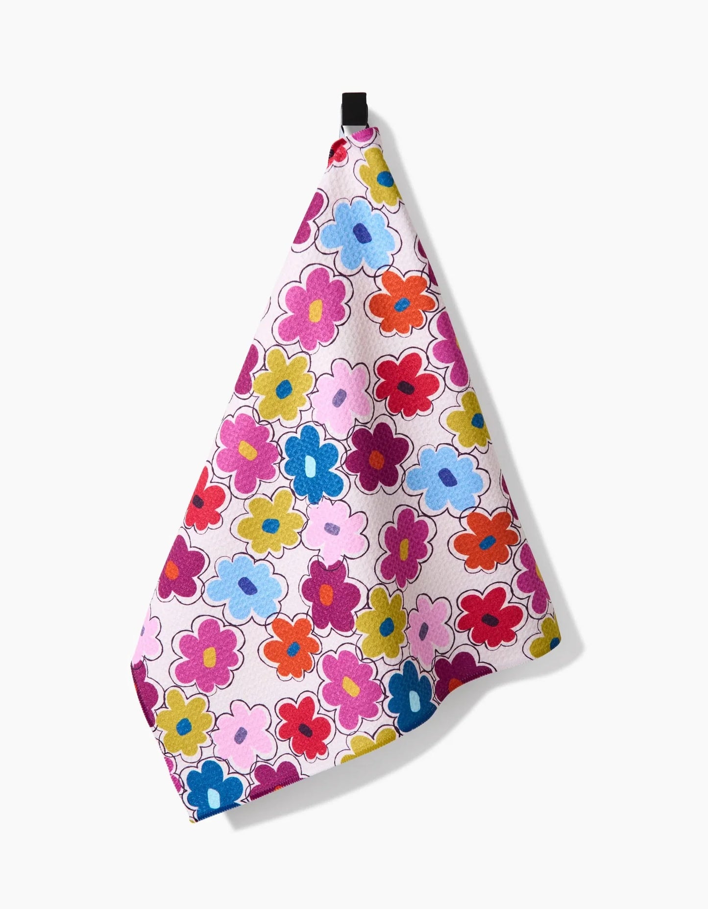 Colorful floral-patterned towel hanging on a white background