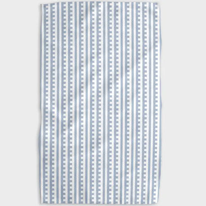 Striped fabric with blue and white pattern on a light gray background