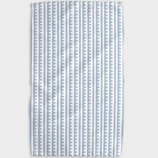 Striped fabric with blue and white pattern on a light gray background
