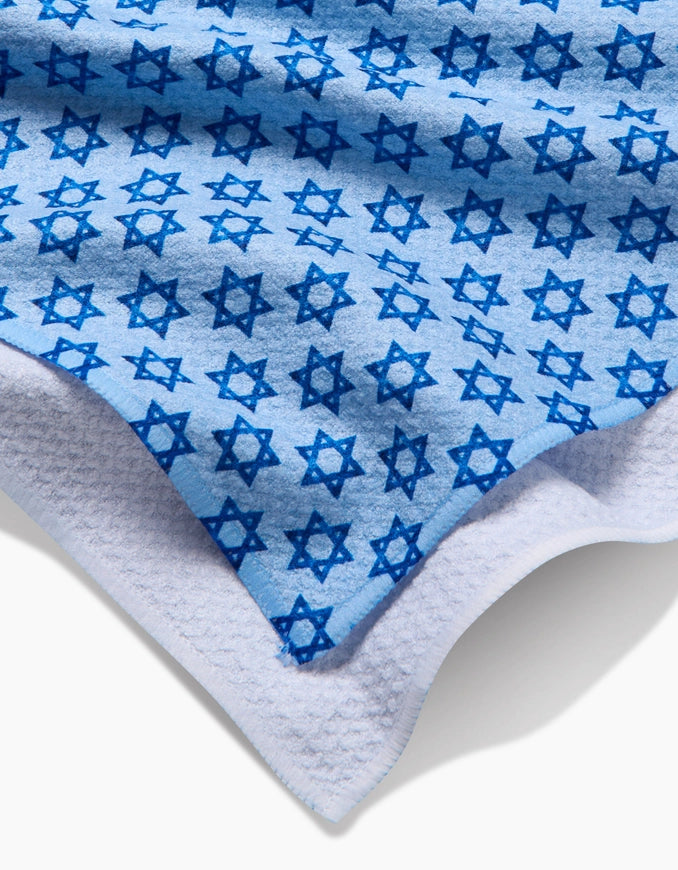 Blue towel with star patterns on a white background