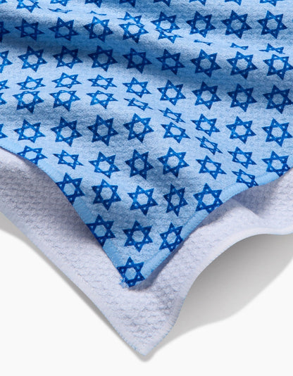 Blue towel with star patterns on a white background