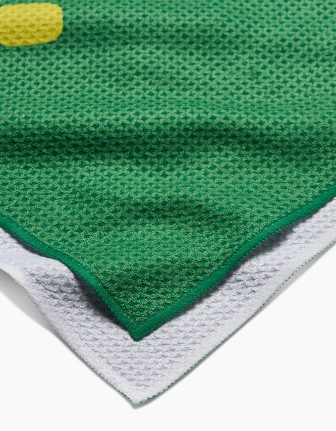 Close-up of a green and white textured fabric corner