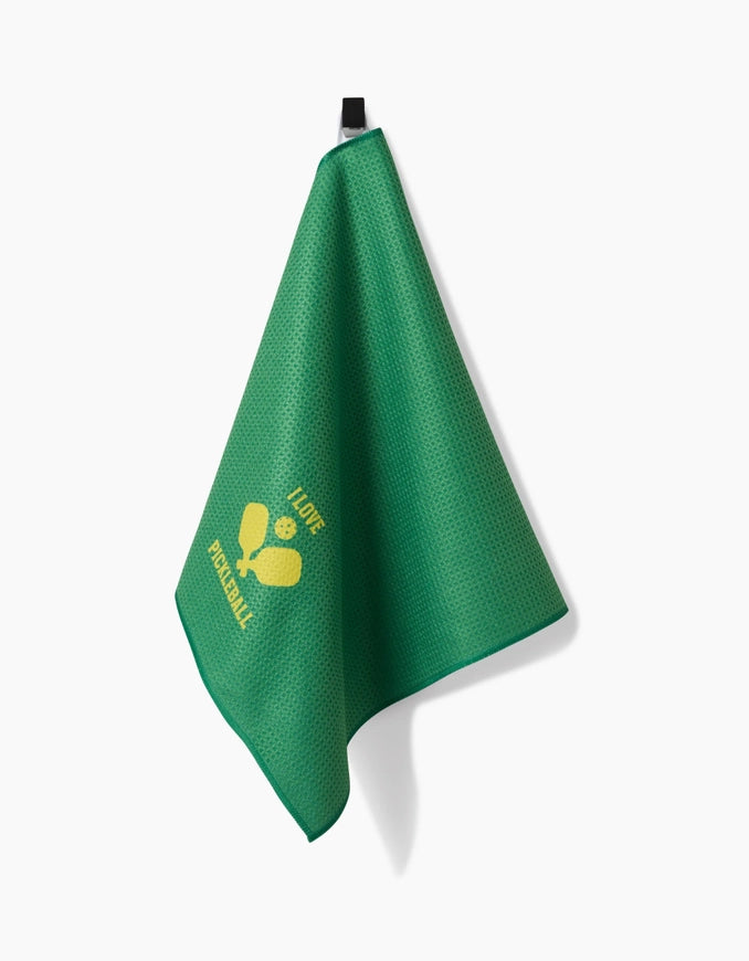 Green towel with yellow logo on a white background