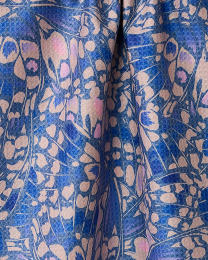 Close-up of a fabric with a blue and beige floral pattern