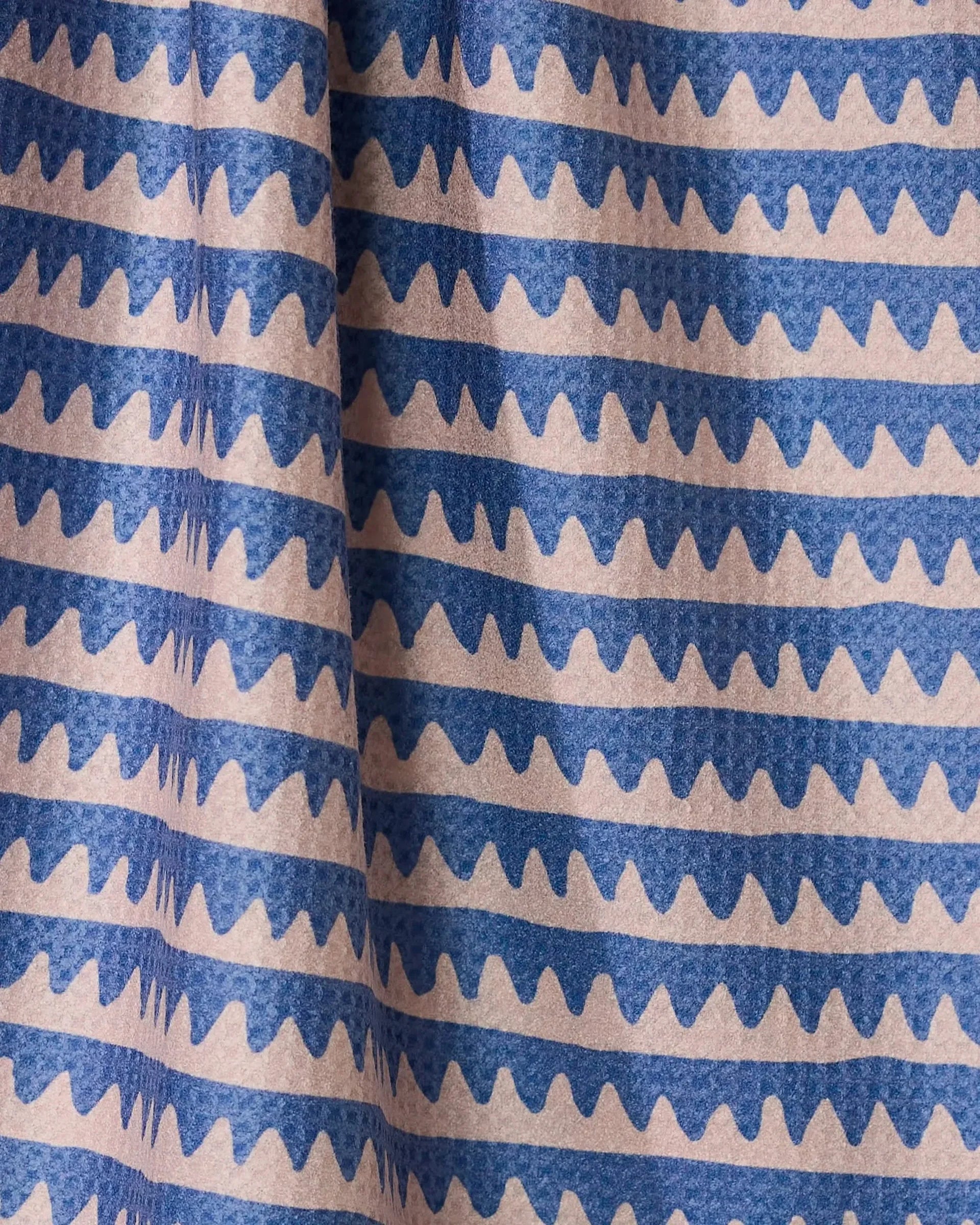 Close-up of fabric with blue and beige striped pattern