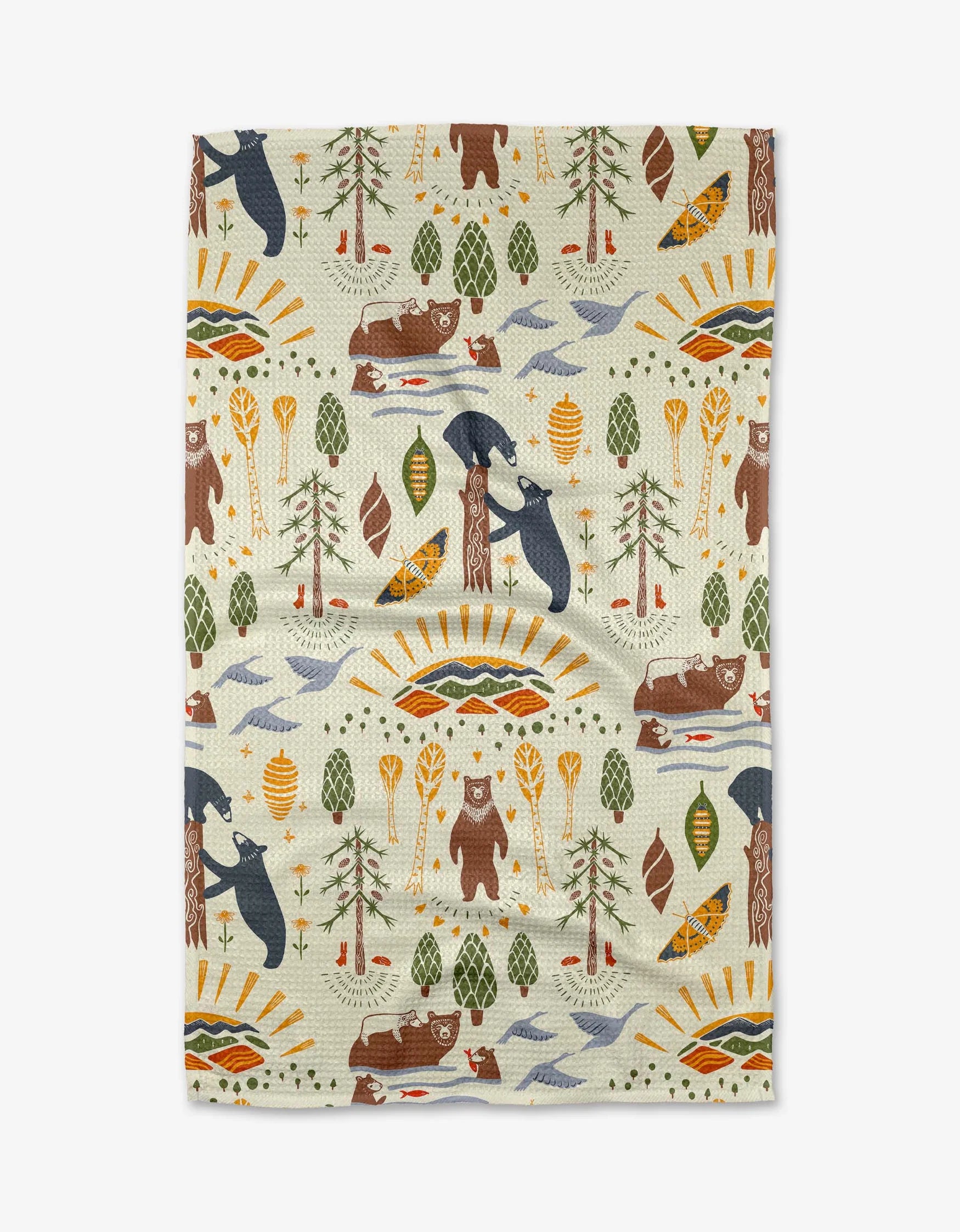 Patterned fabric with bears, trees, and nature-themed designs on a white background