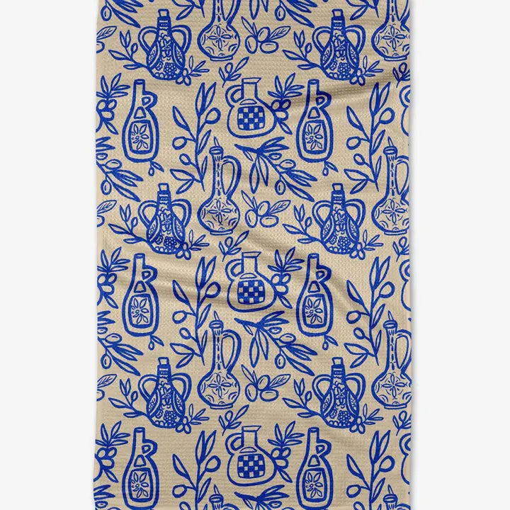 Patterned fabric with blue bottles and leaves on a beige background