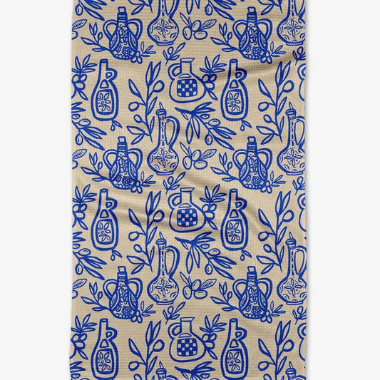 Patterned fabric with blue bottles and leaves on a beige background