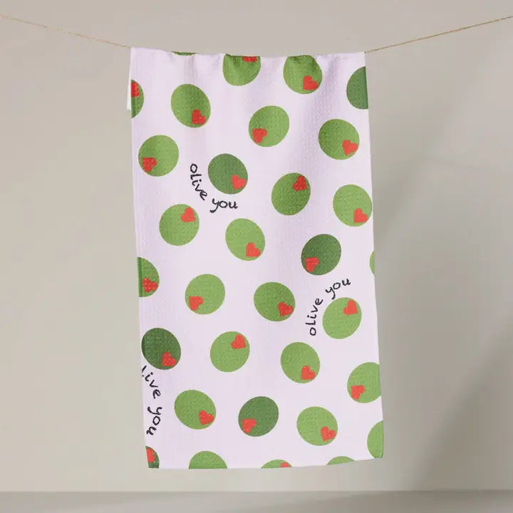 Tea towel with green and red polka dot pattern and 'alive you' text on a white background